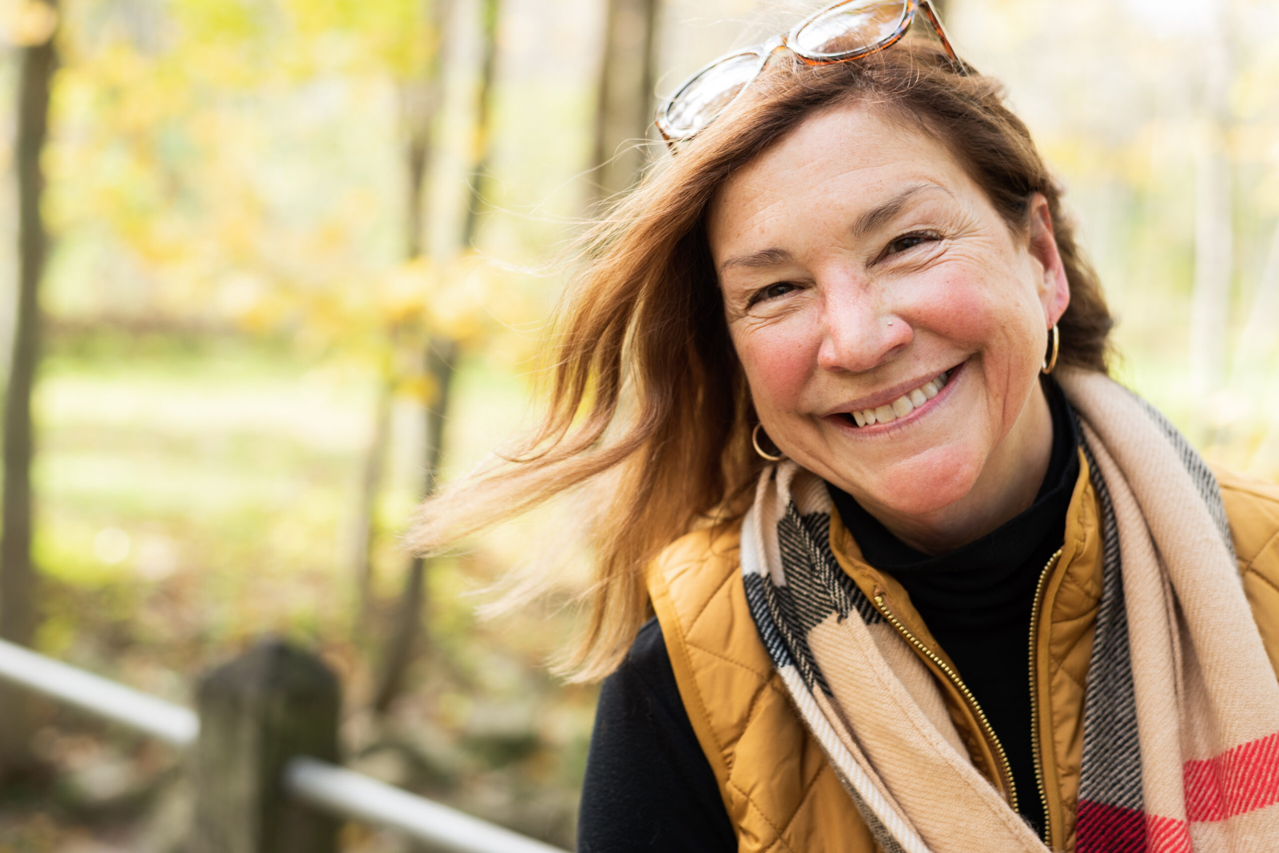 candid portrait of happy woman in autumn